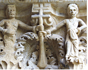 Roger II gives the cross, representing the papal legateship, to his son William I, 
shown crowned (as he was during his father's lifetime). Carving on capital of a column 
in cloister of Monreale's abbey.