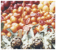 Apples, blood oranges and artichokes in Palermo's Capo market.